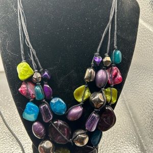 Multi- layered Bead Necklace Multiple colors of purple. 11” Length